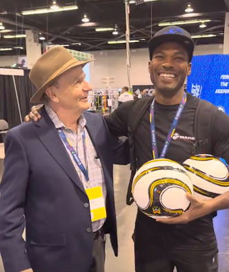 Omar Cummings with Bob Arnell (Inventor PUGG Goal) at the 2024 United Soccer Coaches Convention Perfect Soccer Booth